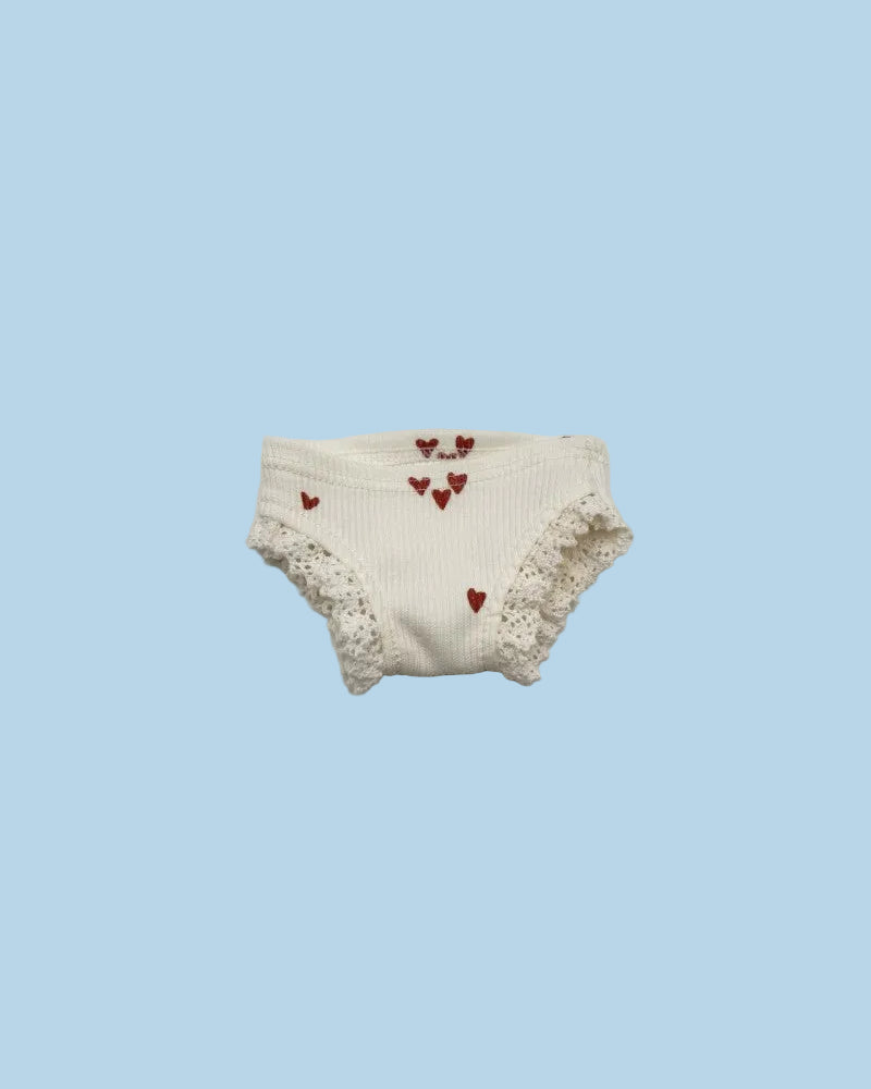 White baby bloomers with red heart patterns