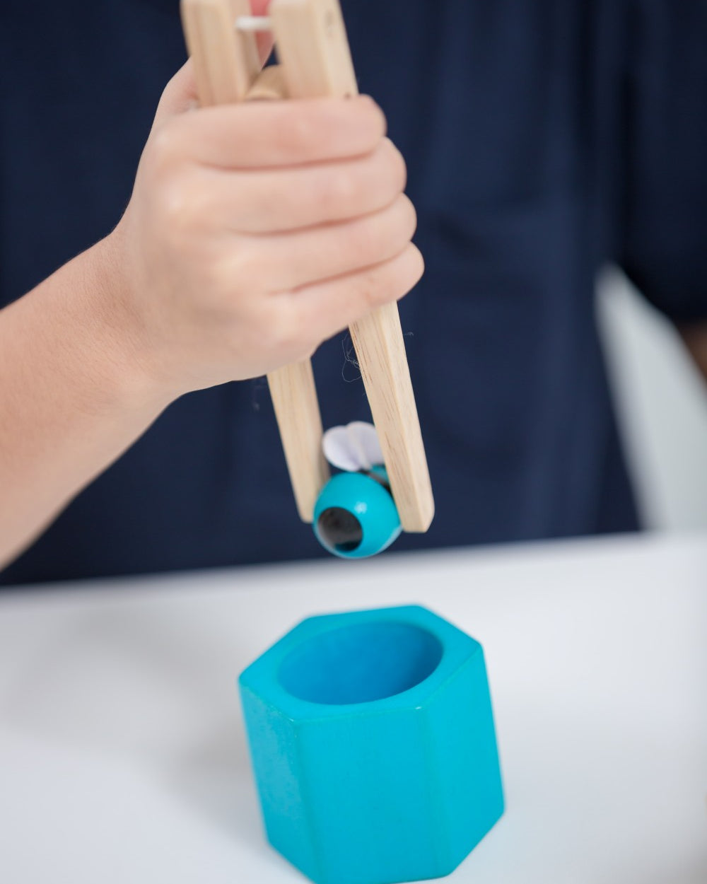 Close-up of PlanToys Beehives sustainable wood construction and vibrant colors