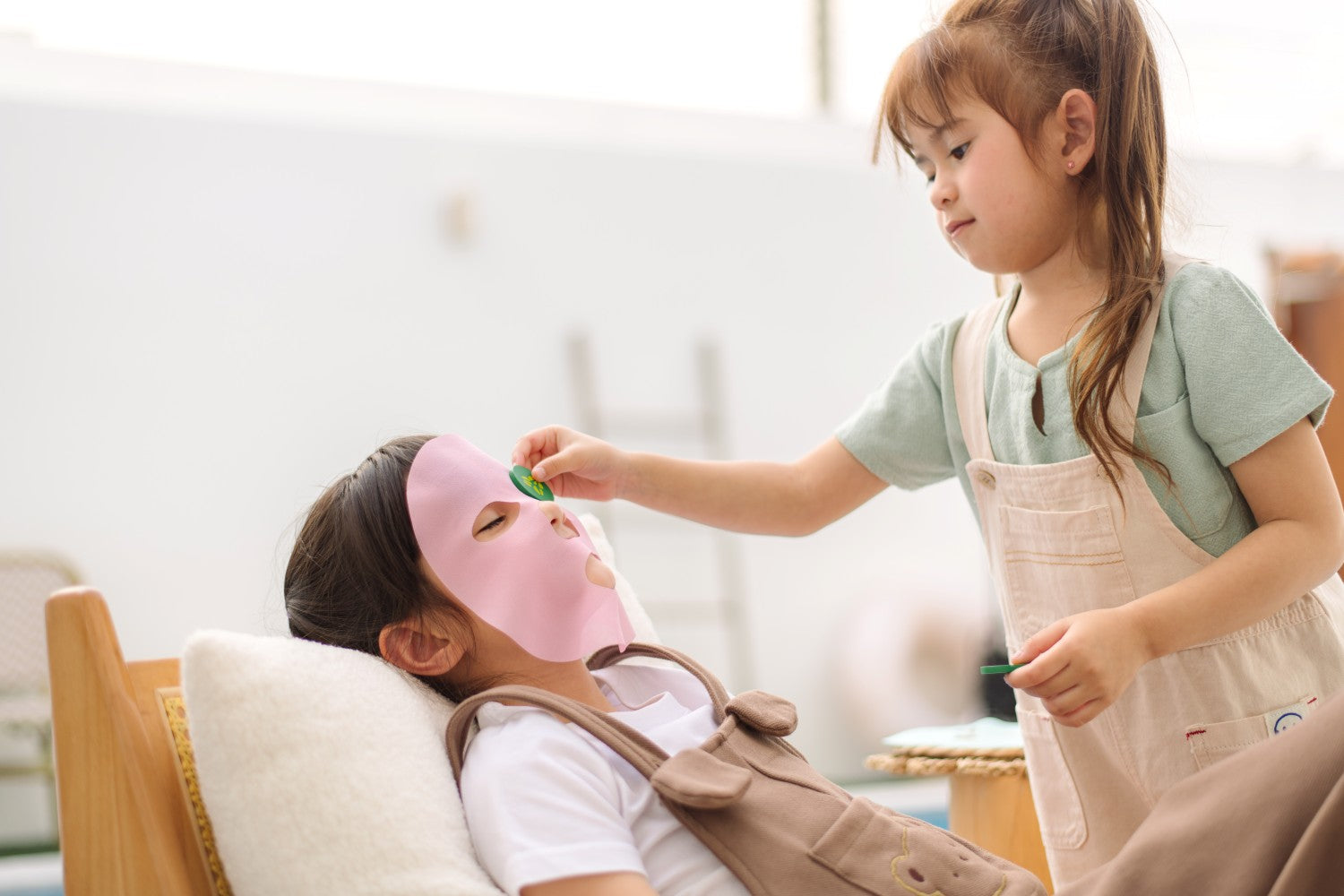 Close-up of PlanToys sustainable wooden spa toys with pastel colors