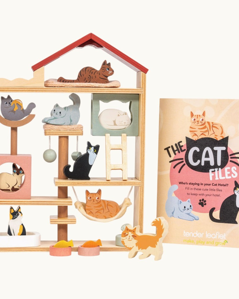 Cat playhouse with various cat-themed items and 'The Cat Files' book on a white background