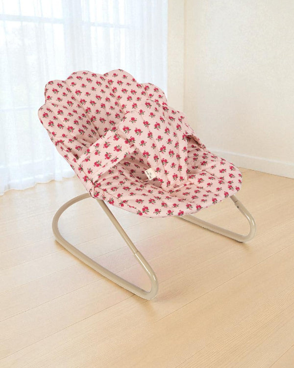 Rosie Rose doll bouncer with vintage pink rose print fabric seat and champagne metal frame showing branded label