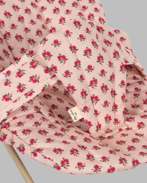 Close-up of Rosie Rose print fabric showing delicate pink roses with green leaves pattern and premium cotton texture