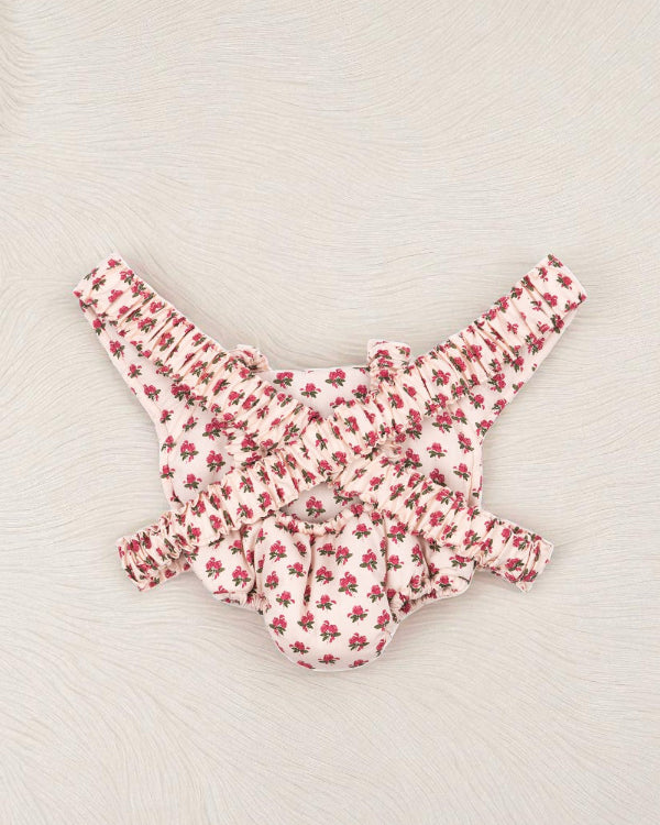Back view of rose print doll carrier showing comfortable strap system and vintage floral pattern coverage