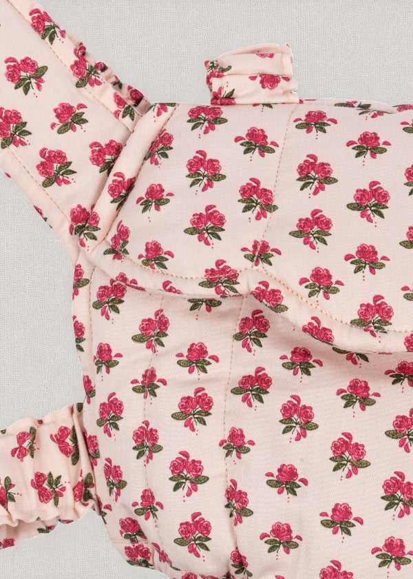 Close-up of Rosie Rose print fabric showing delicate pink roses with green leaves pattern and premium OEKO-TEX cotton construction
