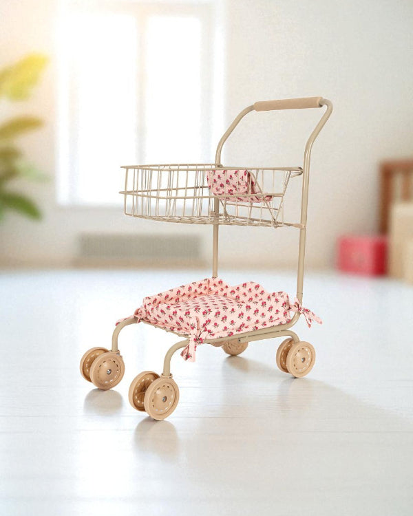 Ergonomic champagne-colored handles with comfortable grip designed for small hands during pretend play shopping adventures