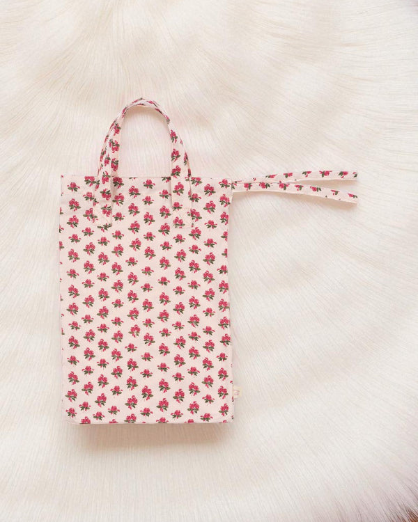Coordinating rose print tote bag for organizing and storing complete nursery set accessories