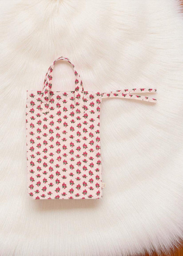 Coordinating rose print tote bag for organizing and storing complete nursery set accessories