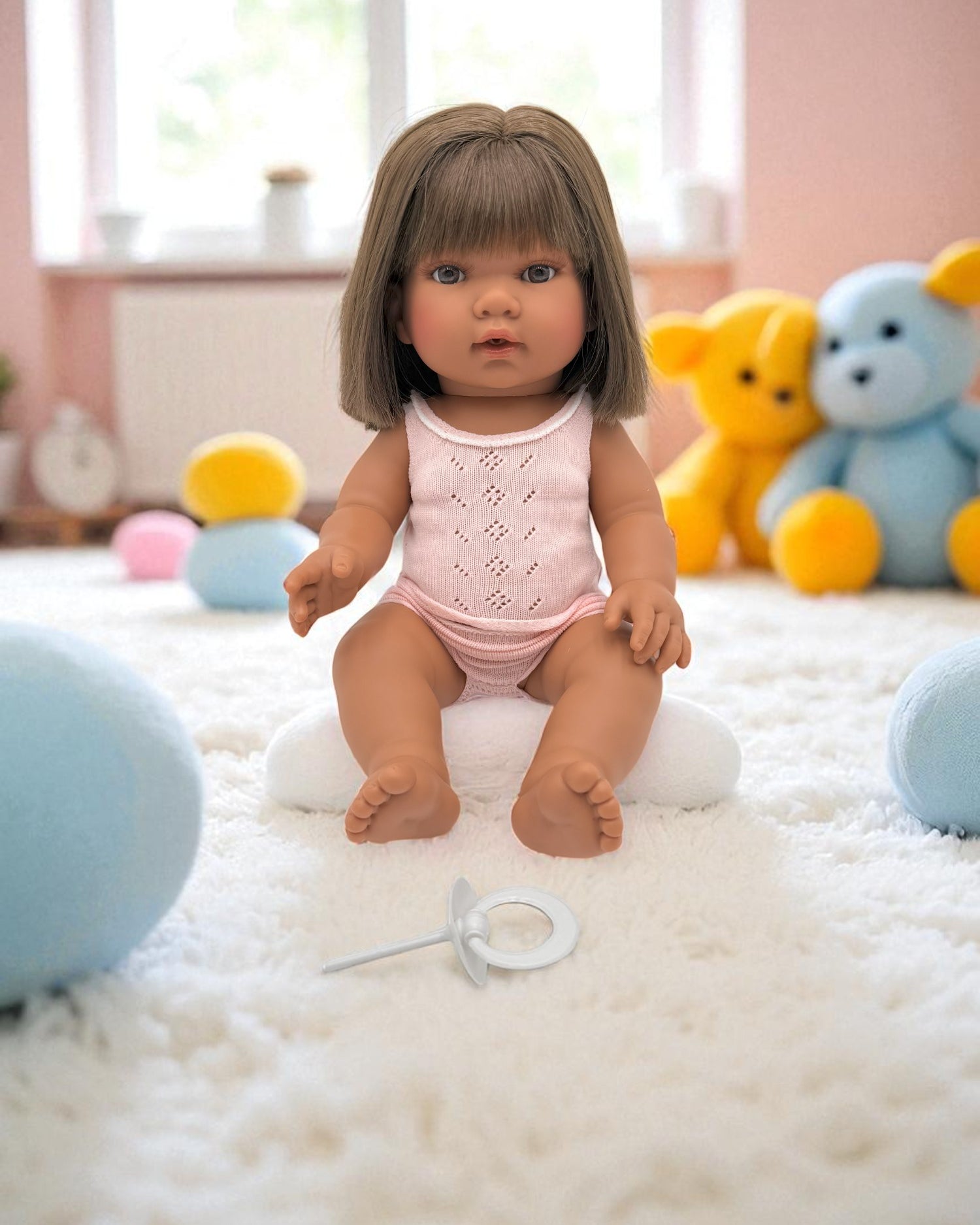 Fully clothed diverse baby doll with brown hair for imaginative care play