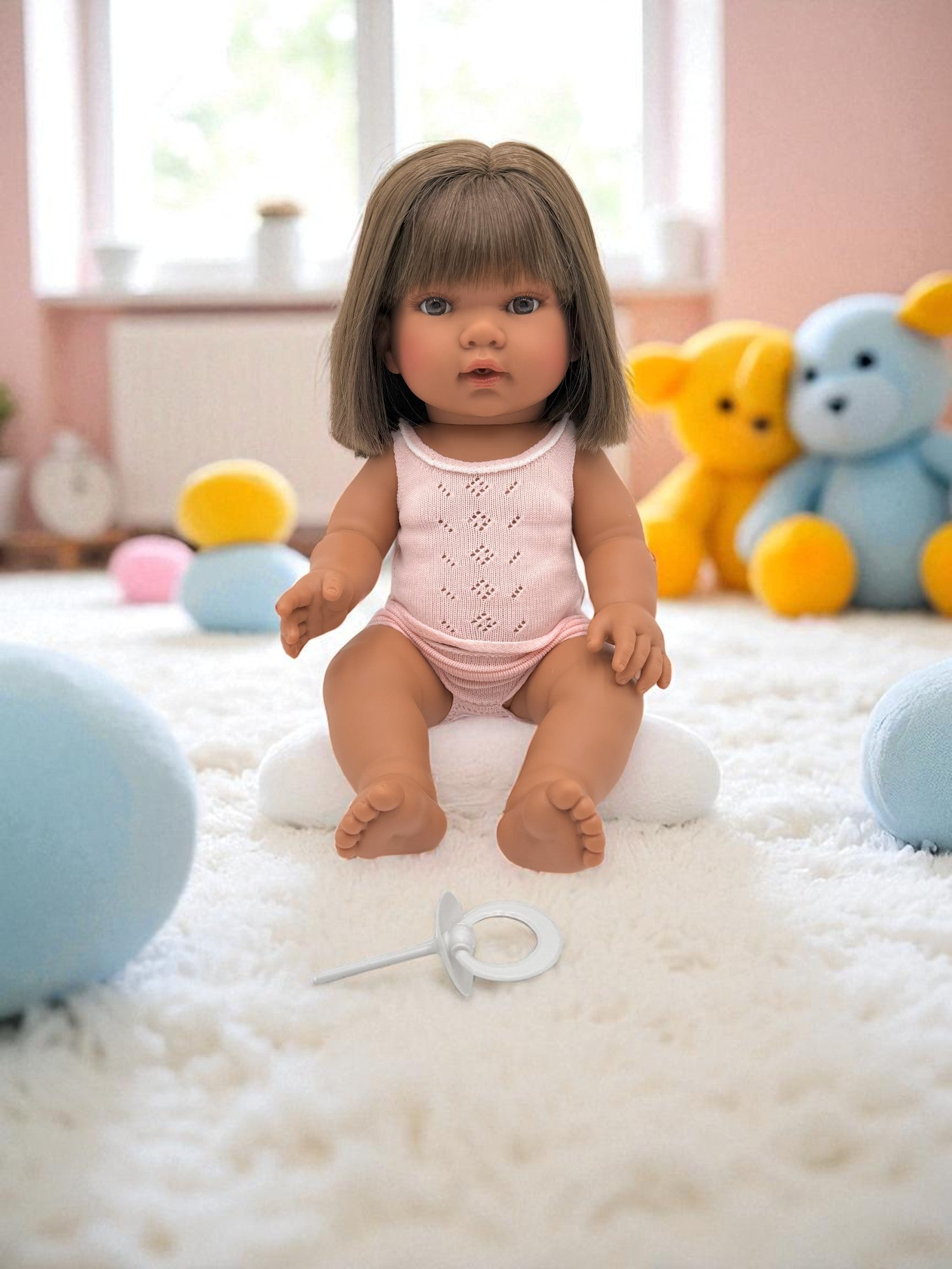 Fully clothed diverse baby doll with brown hair for imaginative care play