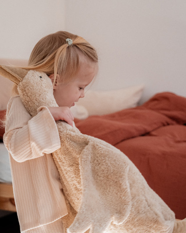 Handcrafted organic cotton goose stuffed animal shown flat with removable warming pillow