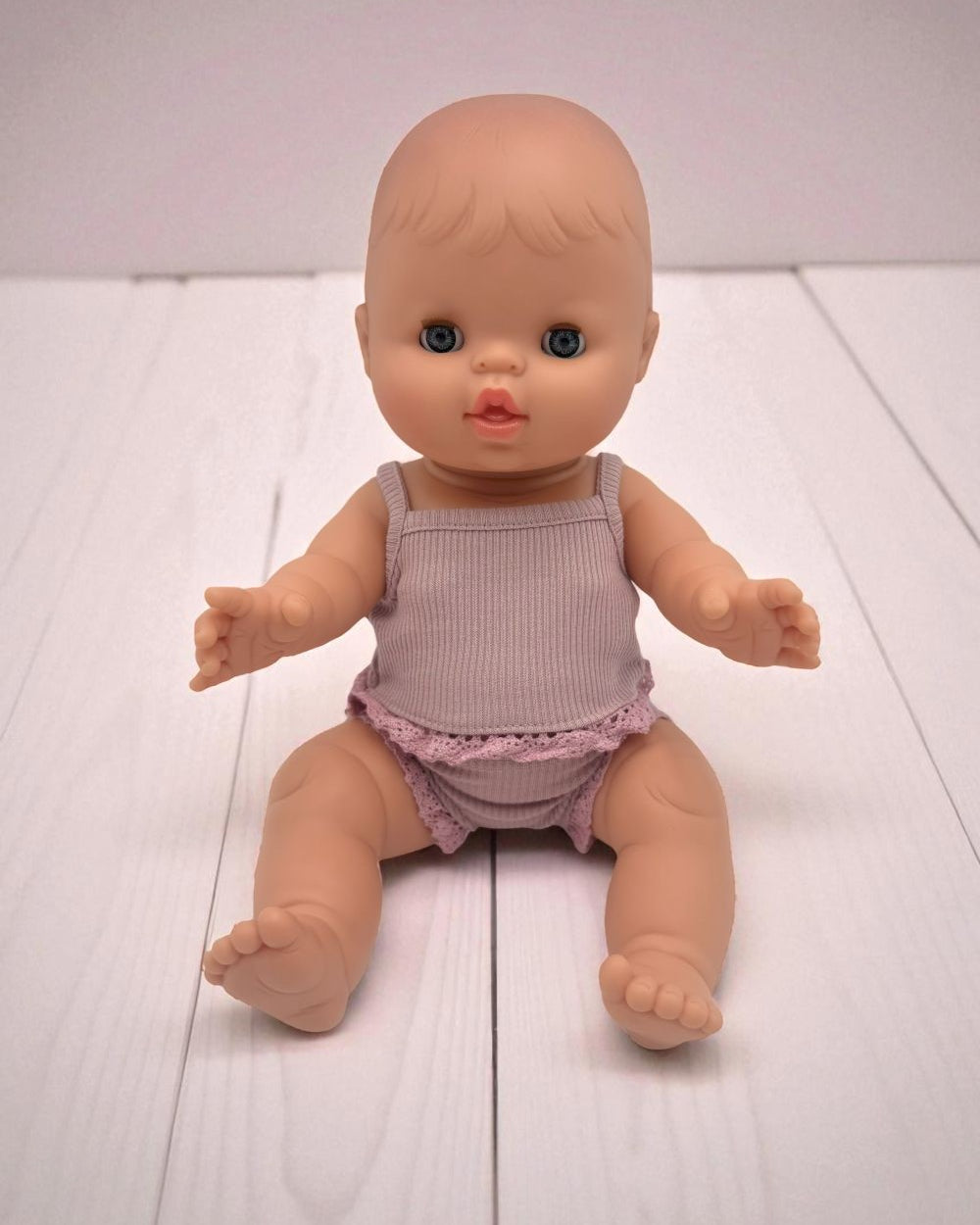 Sleepy European baby girl doll with closing eyes Minikane 13 inch hard body vinyl doll