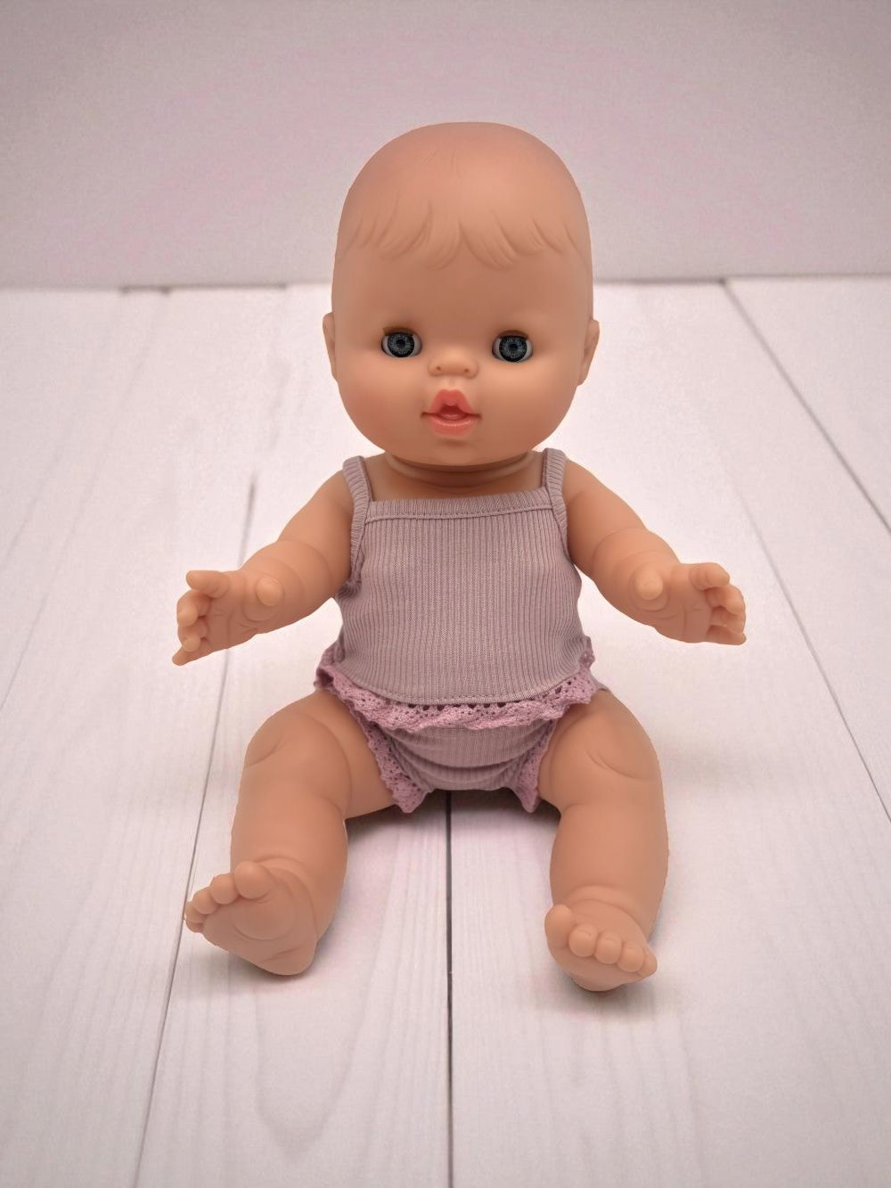Sleepy European baby girl doll with closing eyes Minikane 13 inch hard body vinyl doll