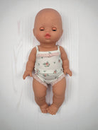 European baby girl doll with sleeping eyes Minikane articulated hard body doll