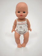Sleepy baby girl doll closing eyes feature Minikane 13 inch premium vinyl construction