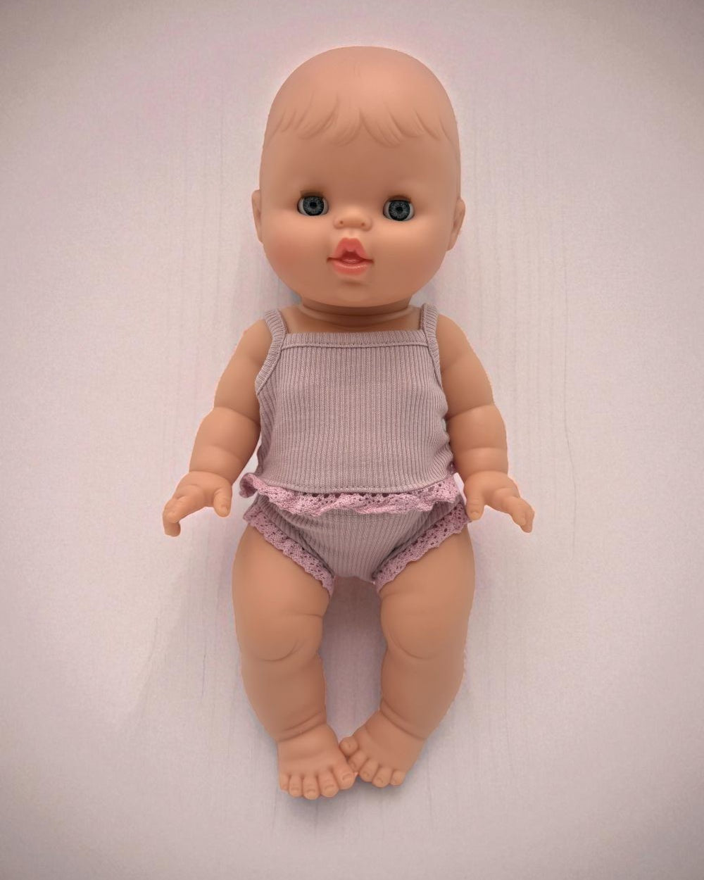 Minikane European girl doll with blue closing eyes anatomically correct sleepy version
