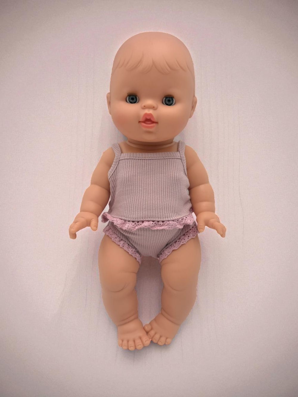 Minikane European girl doll with blue closing eyes anatomically correct sleepy version