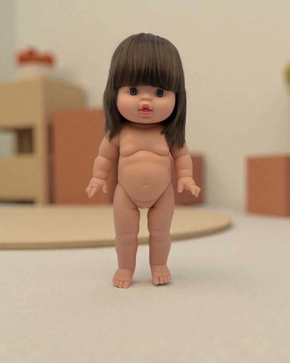 Minikane hard body Chloe doll standing independently with articulated limbs