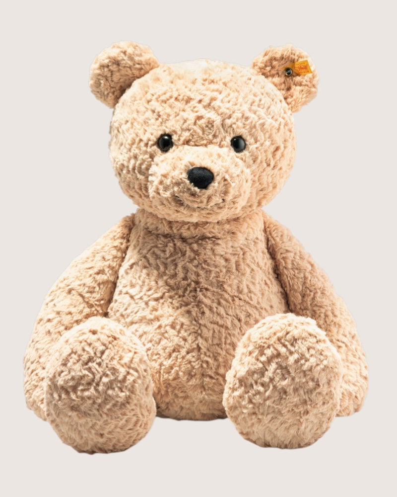 Plush teddy bear on a light gray background