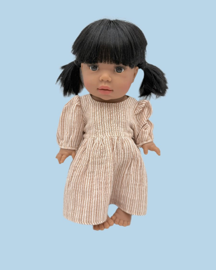 Miniature baby doll clothes with detailed stitching