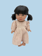 Miniature baby doll clothes with detailed stitching