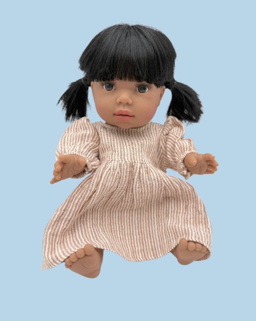 Handcrafted doll clothes in neutral linen fabric
