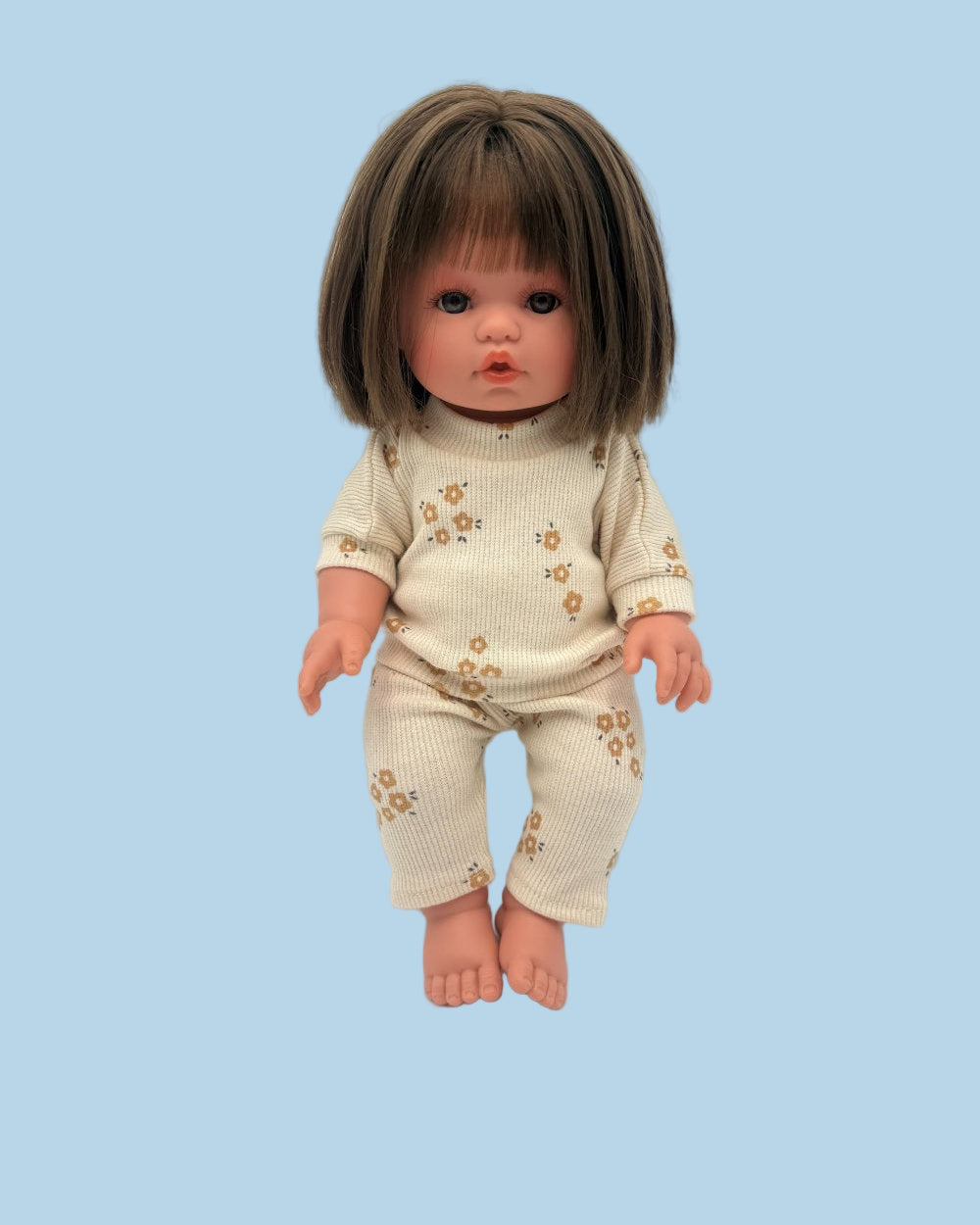 Cozy doll outfit featuring oat beige ribbed sweatshirt and pants with caramel flower pattern