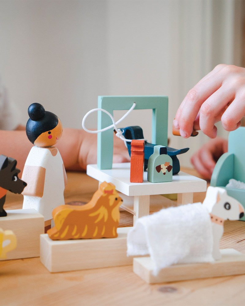 Children playing with wooden toys on a wooden table