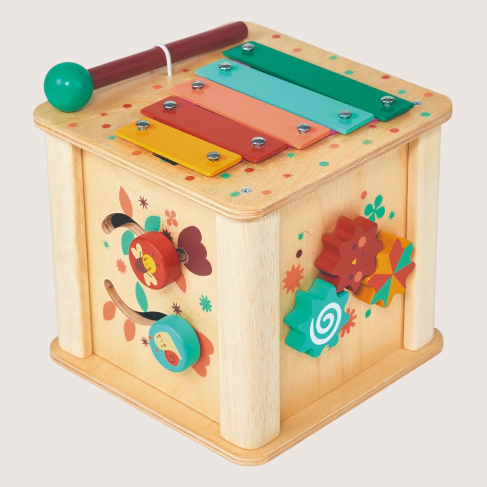Colorful wooden toy with various interactive elements on a light background