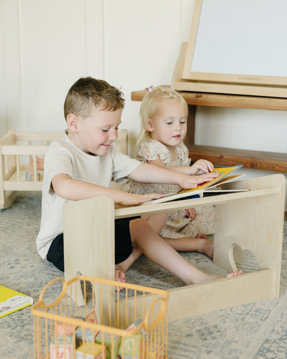 Two Children Reading on Lap Desk