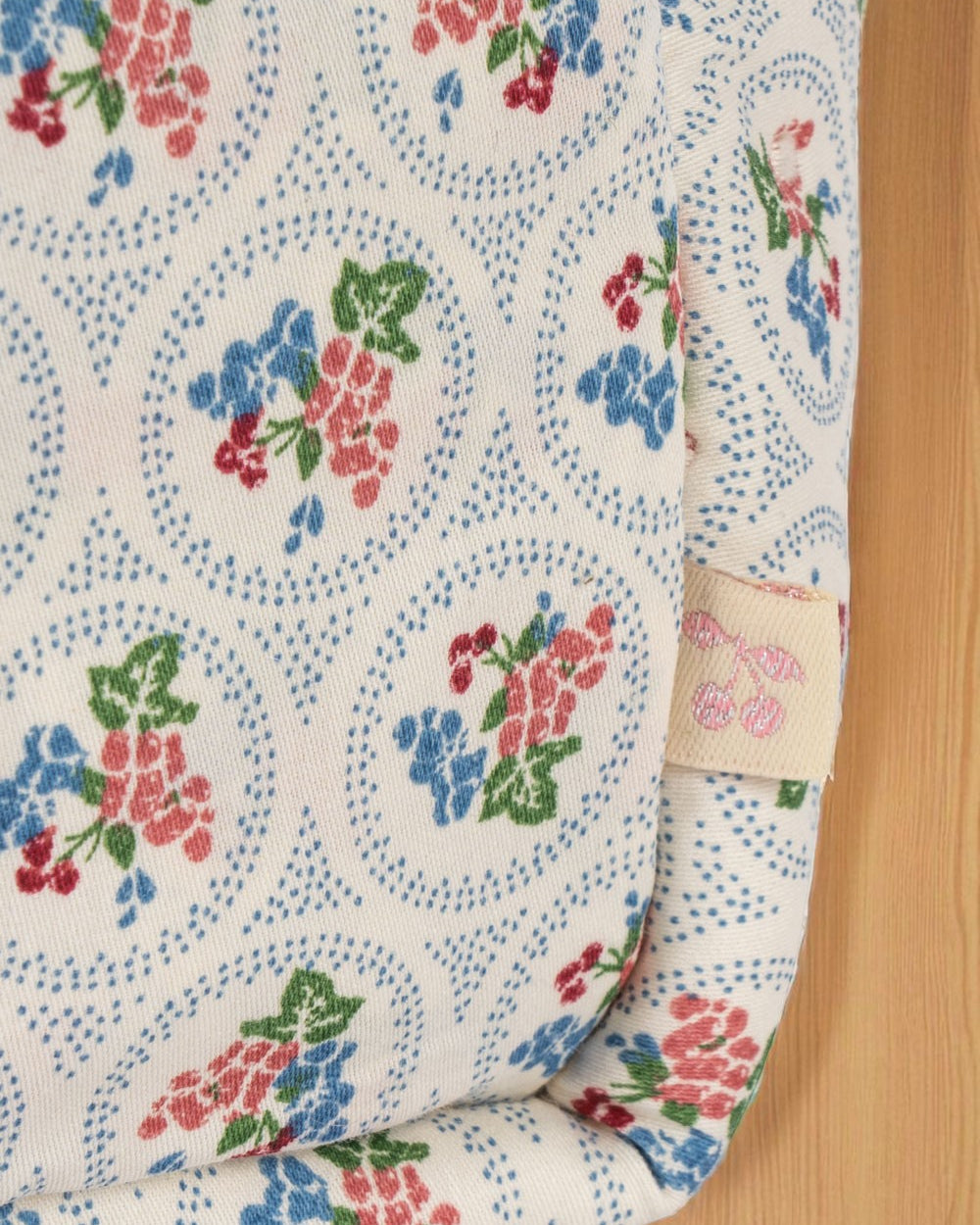 European-inspired children's doll care bag with cottage-core botanical pattern