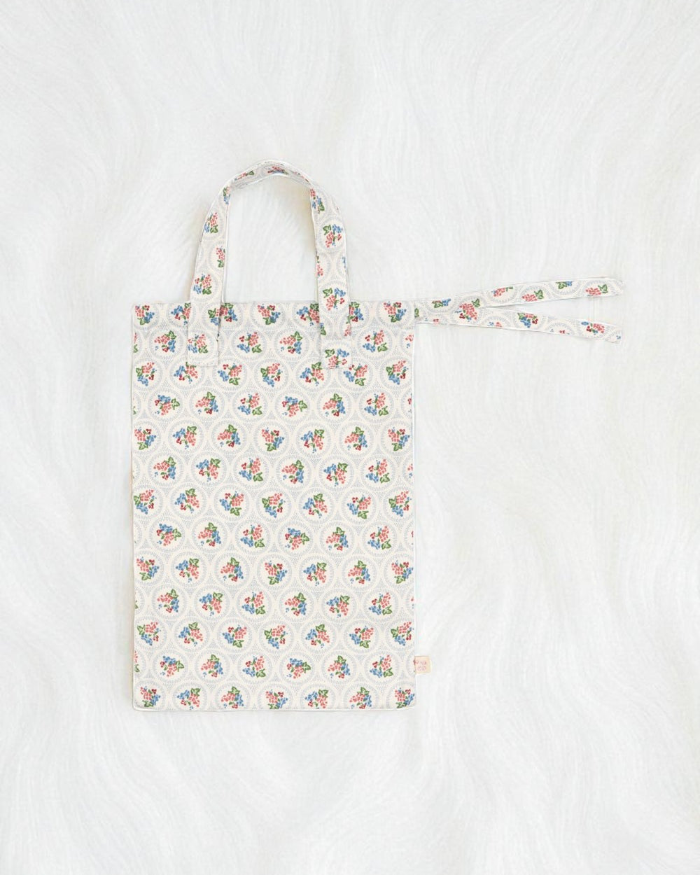 Premium construction detail showing button-tufted craftsmanship of Verona Blues doll bedding set