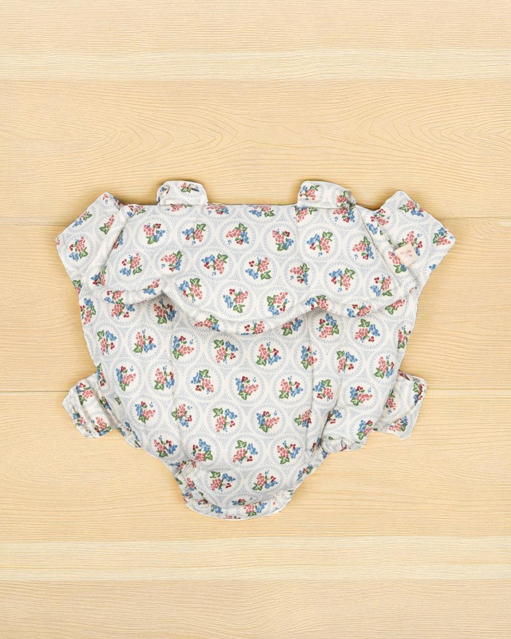 Verona Blues doll carrier with Italian-inspired floral print and comfortable scrunch straps for hands-free doll carrying