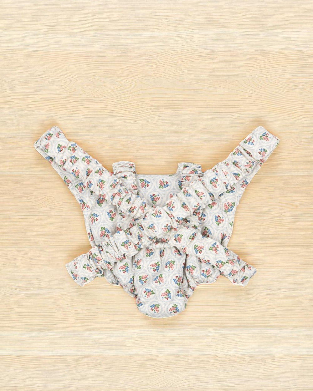 Back view of Verona Blues carrier showing blue floral bouquets with cherry accents and complete Mediterranean pattern