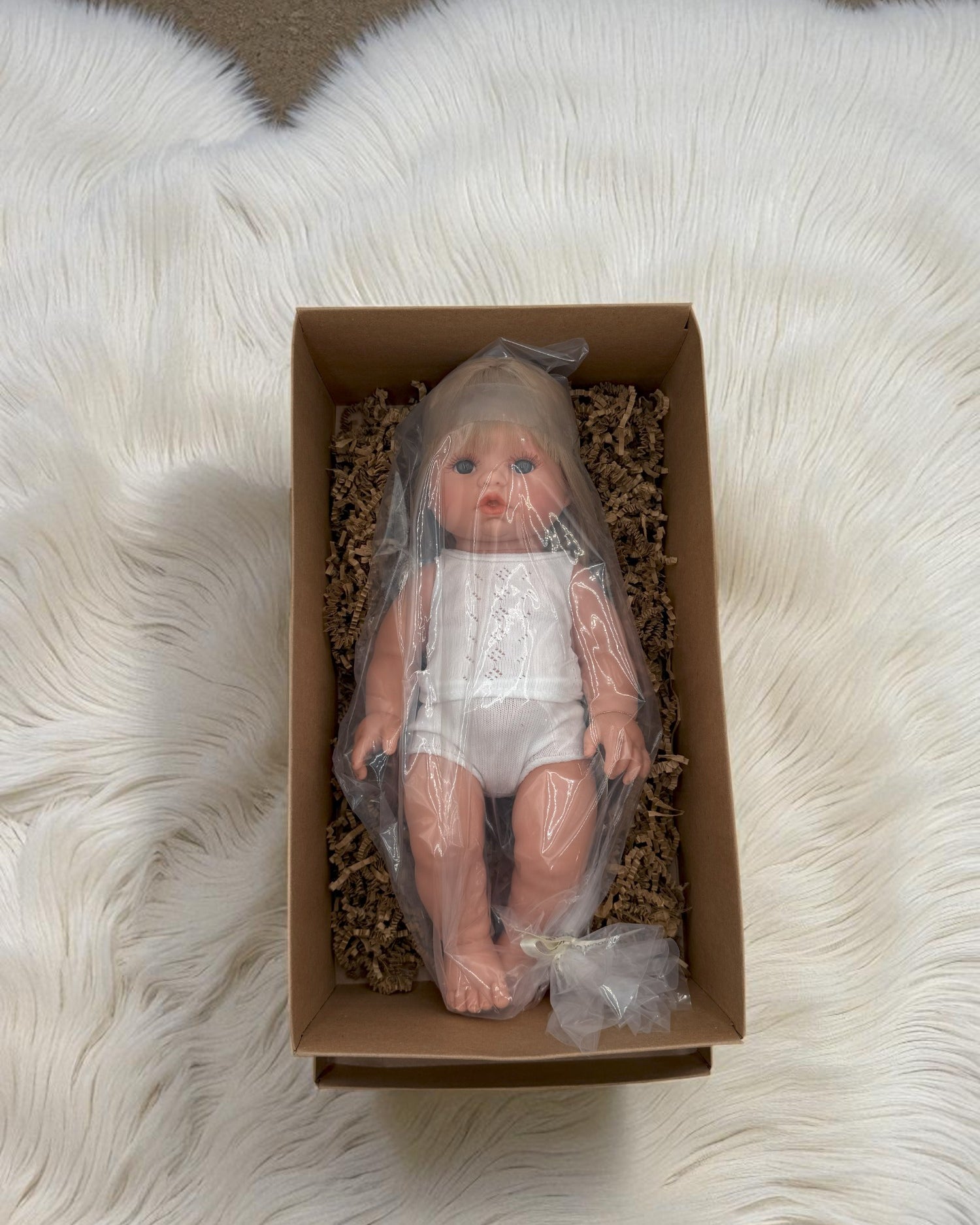 Blonde hair blue eyes baby doll for imaginative play scenarios