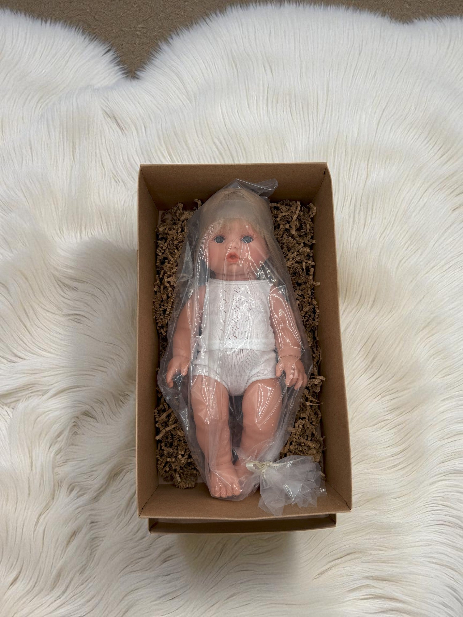 Blonde hair blue eyes baby doll for imaginative play scenarios
