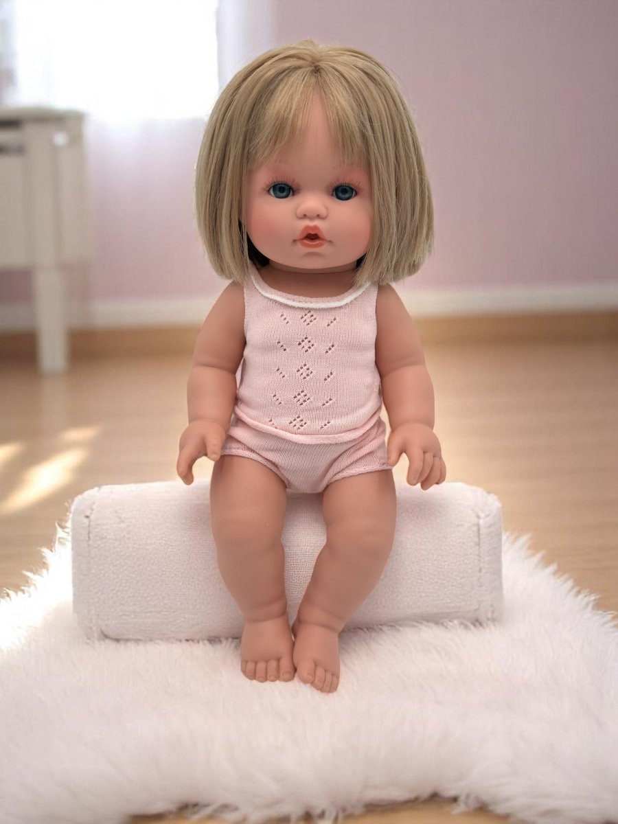 Real life baby doll Vienna featuring captivating blue eyes ideal for children's playroom nurturing experiences