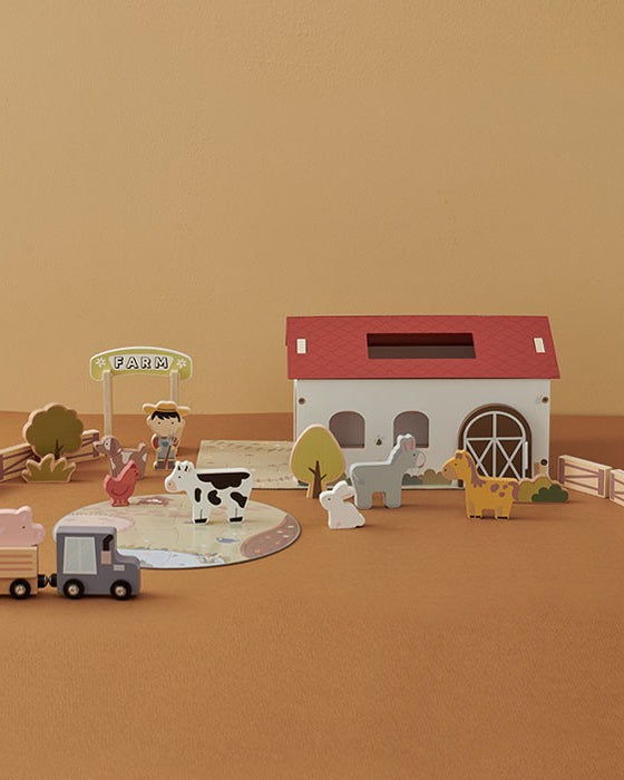 Fiesta 25-piece wooden farmhouse playset displayed with barn, animals, farmer, truck, and puzzle mat on white background