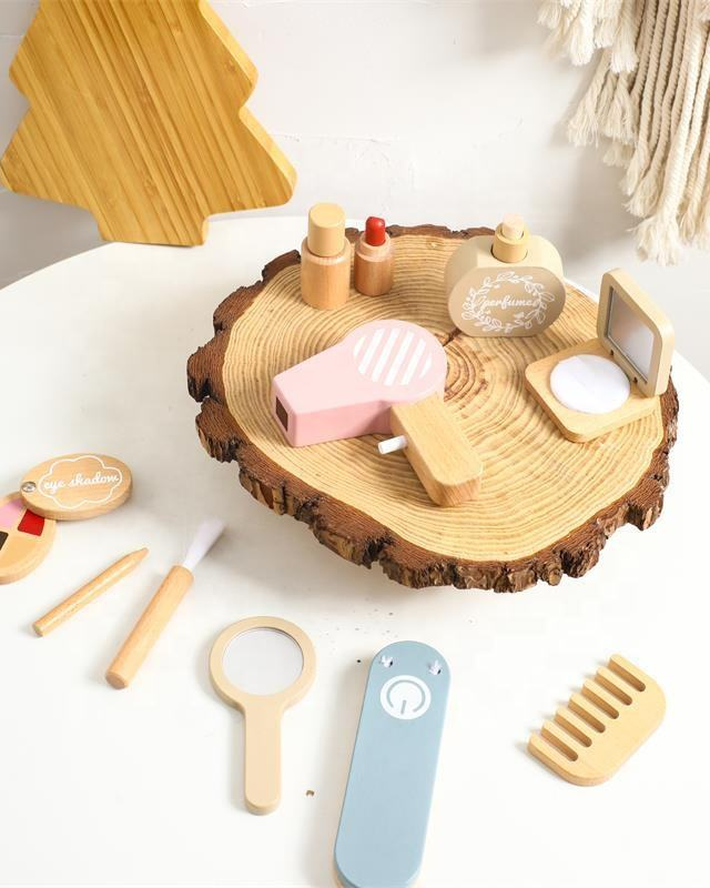 Set of wooden toys resembling a beauty salon on a white surface.