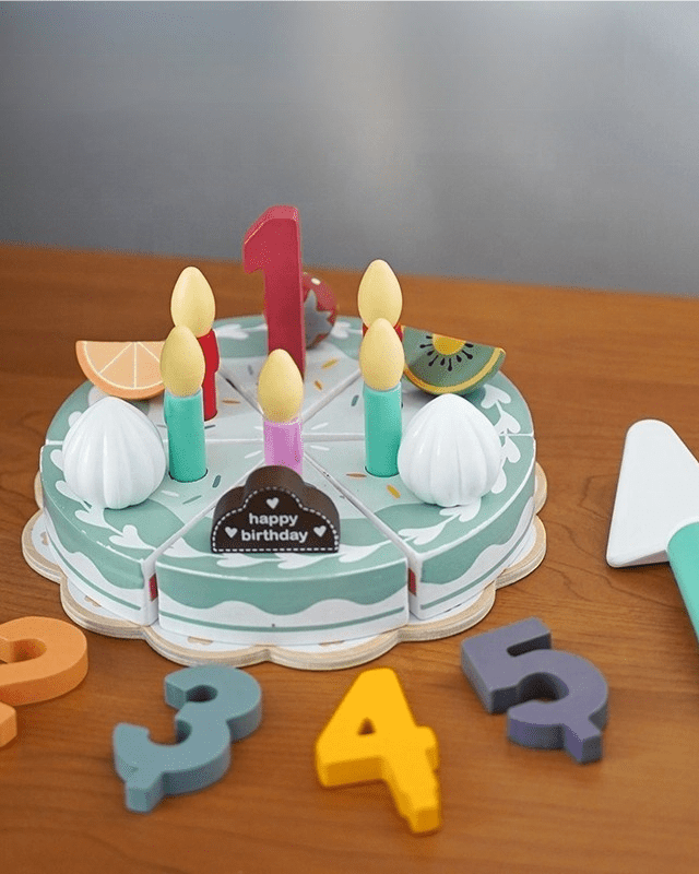 Wooden Montessori birthday cake toy with removable slices and colorful number pieces for pretend play