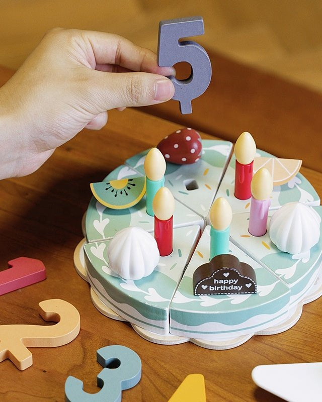 Complete wooden birthday cake Montessori playset showing all decorative elements and accessories
