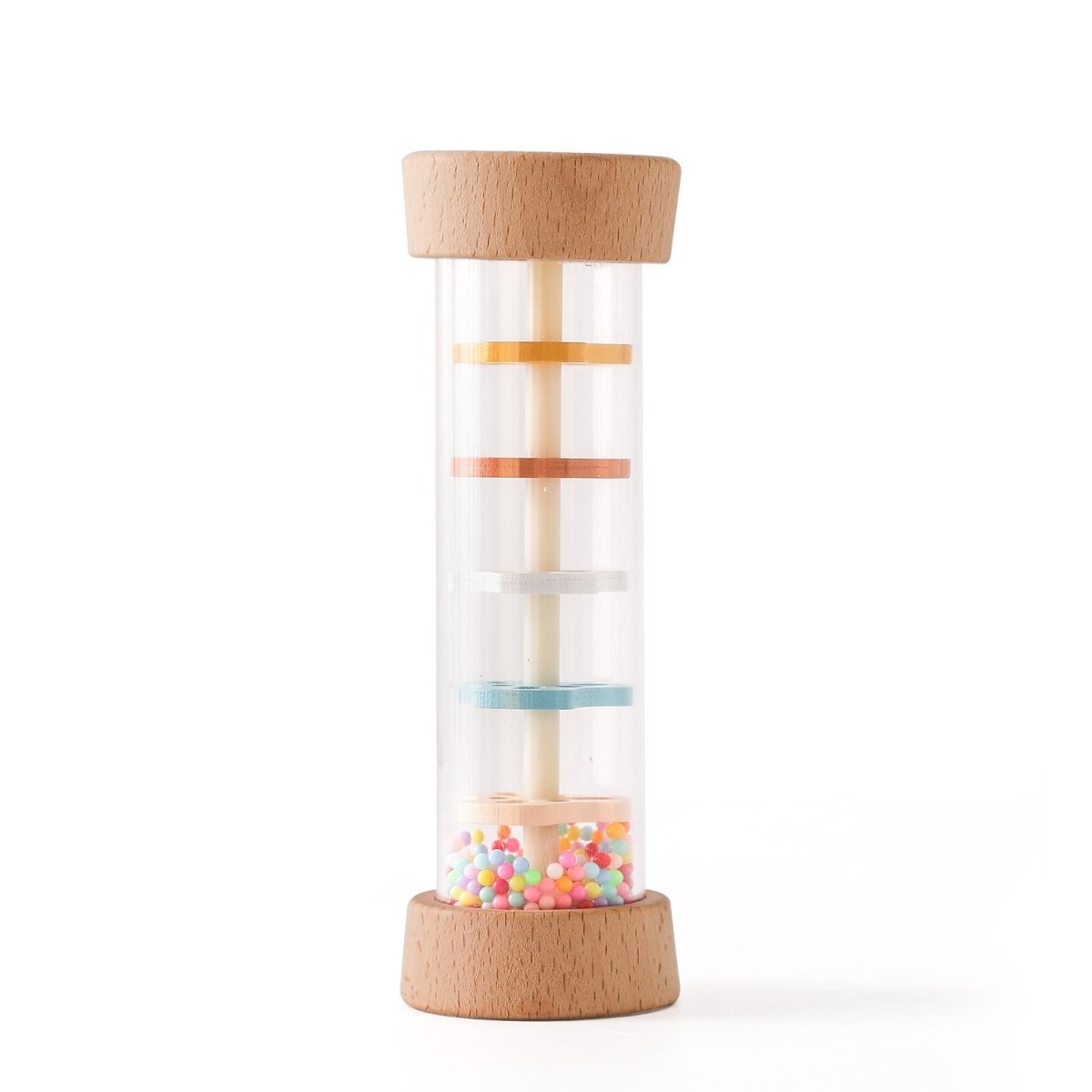 Close-up of Montessori rain sound toy showing pastel colored internal discs and rainbow beads