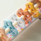 Montessori wooden rain sound cylinder displayed in playroom setting demonstrating sensory play value