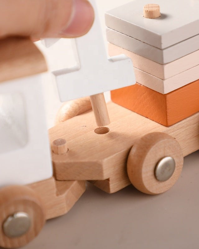 Complete Montessori wooden train set featuring engine and three unique cargo cars for developmental play