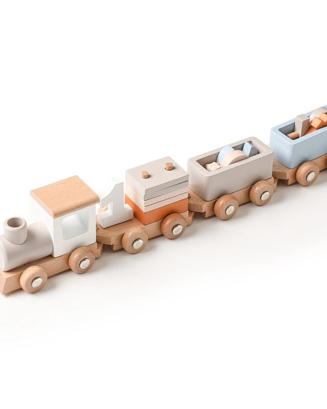 Natural wood toy train with non-toxic pastel blue and white accents for playroom display