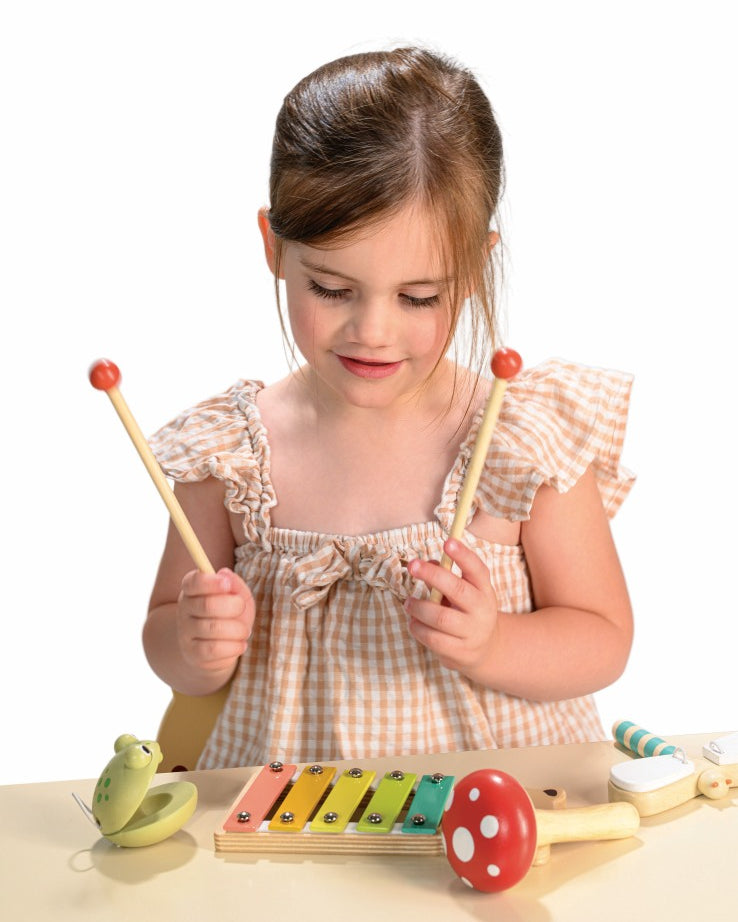 Four wooden musical instruments from Mentari with forest animal themes