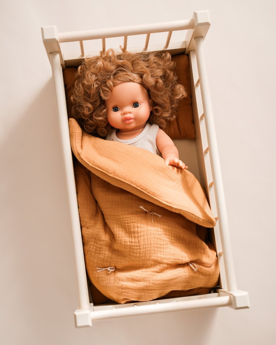 Premium doll accessories including quilted bedding set for imaginative play