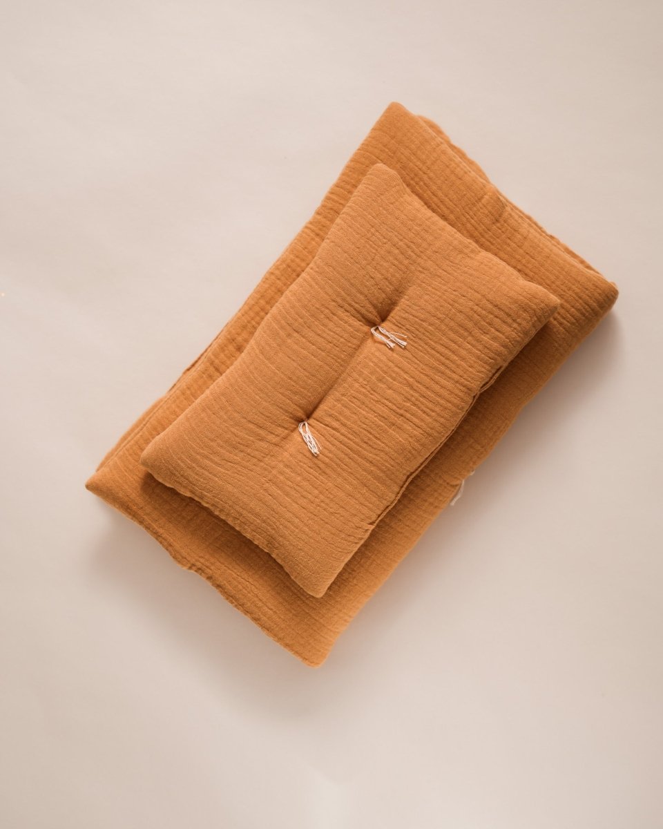 Cozy doll blanket and pillow combination for nurturing playroom activities
