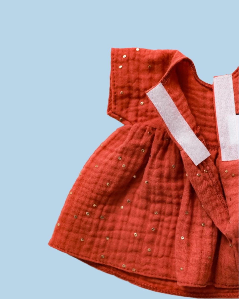 Tiny pearl buttons on baby doll clothes