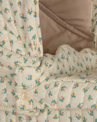 Premium French-inspired doll stroller featuring tiny colorful flowers with organic cotton mattress and metal frame