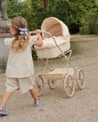 Premium doll stroller featuring multi-colored star pattern with organic cotton mattress and metal frame